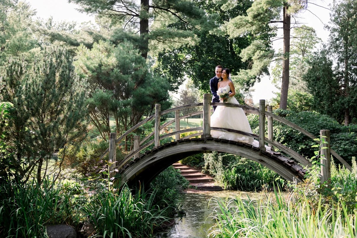 Wedding film still on a Japanese garden bridge in Geneva, Illinois